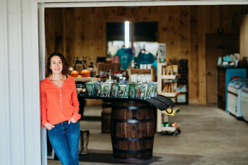 Cheryl Haskett of Udderly Ridiculous stands in her on farm market