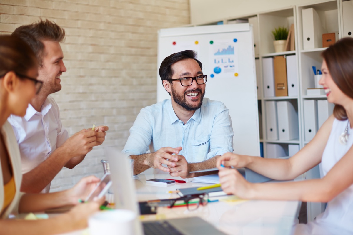 Group of young business people around a table
